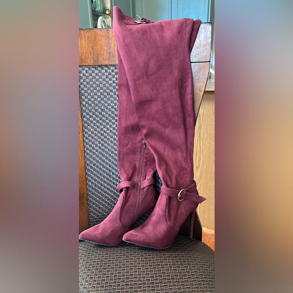 Thigh high heel boots that are size 8 and are a maroon color from Ami Clubware.